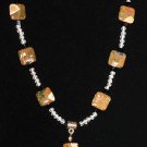 Item 10- 15" glass, rhyolite, Tibetan silver necklace.