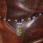 Item 83- 13" boot bracelet. glass, enamel & silverplate.