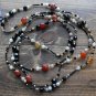 Item 29- 54" Agate, antique glass and brass necklace.