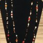 Item 29- 54" Agate, antique glass and brass necklace.