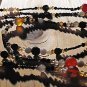 Item 29- 54" Agate, antique glass and brass necklace.