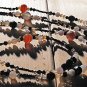 Item 29- 54" Agate, antique glass and brass necklace.