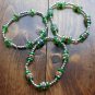 Set of 3 glass and silverplate bracelets.