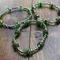 Set of 3 glass and silverplate bracelets.