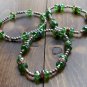 Set of 3 glass and silverplate bracelets.