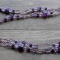 Item 44- 21" Double strand amethyst, glass, and silverplate necklace.