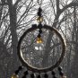 Item 99- 4" suncatcher: gold 'leather' wrap, and glass.
