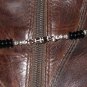 Item 138- 13.5" Glass, silver & serpentine boot bracelet.