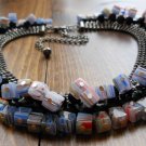 Item 143- 12.5" glass and metal choker with 4.5" extension chain and matching earrings.