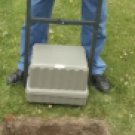 CREMATION VAULT LOWERING DEVICE