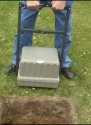 CREMATION VAULT LOWERING DEVICE