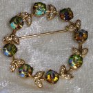 vintage pin brooch wreath of aurora borealis green flowers gold tone