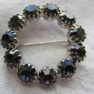 Vintage pin brooch black smokey circle of rhinestones stunning