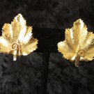BSK Signed Gold tone vintage earrings maple leaf Canada textured clip on