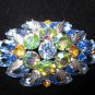 Vintage pin brooch Aurora borealis Blue & amber rhinestones what a shine.