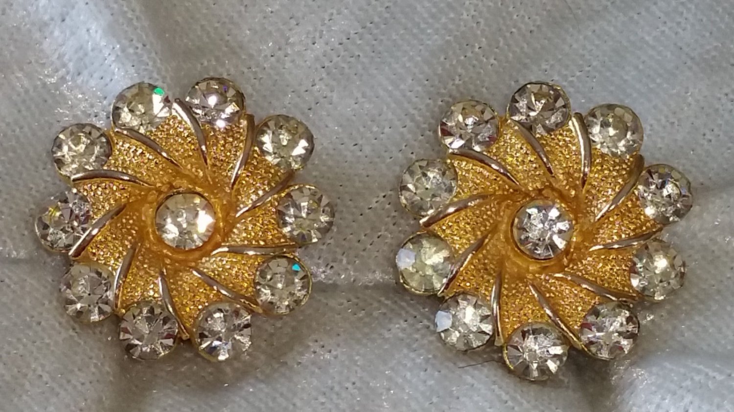 Signed BSK Gold tone textured flower earrings clear rhinestone vintage bling