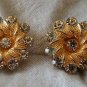 Signed BSK Gold tone textured flower earrings clear rhinestone vintage bling