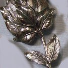 Silver tone leafy flower bud pin signed Botticelli vintage pin brooch 1969-78