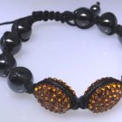 Bracelet with Hematite beads with orange sparkle decor, new not worn