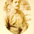 World War I Real People Postcard German Soldier Writing on Back Divided No Used