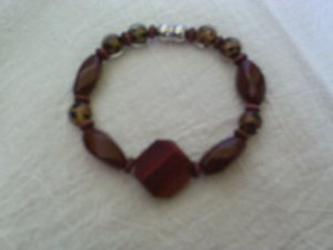 Brown and gold glass beaded bracelet by Jesse james