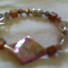 Pink and gold glass beaded bracelet by Jesse James