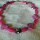 Choker Necklace with pink and black acrylic beads.