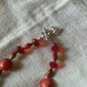Jesse James red with black and gold glass beaded necklace