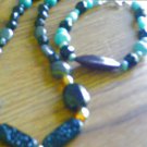 Handcrafted teal and black glass beaded necklace and bracelet
