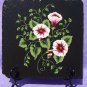Black Trivet With Burgundy and White Flowers