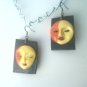faces in the sun polymer earrings
