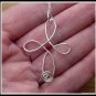 Handmade Cross Pendant with Ruby wire wrapped in Sterling Silver with chain, July birthstone
