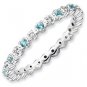 Silver stackable ring with blue topaz eternity band