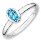 Silver stackable ring with blue topaz oval