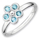 Silver stackable ring with blue topaz flower