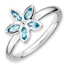 Silver stackable ring with blue topaz flower