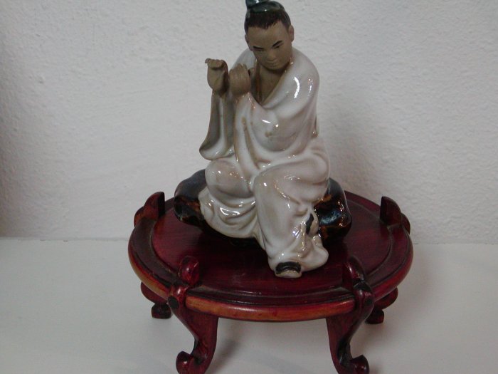 Hand Painted Clay Oriental Man Playing Flute