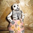 Ceramic Day of the Dead Figure, Woman in Pink Skirt with Yellow Flower Design