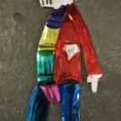 Hand Painted Tin Day of the Dead Figure, Man in Red Shirt with Blue Pants Wearing Scarf and Hat Hand Painted Tin Day of the Dead Figure, Man in Red Shirt with Blue Pants Wearing Scarf and Hat