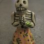 Ceramic Day of the Dead Figure, Woman in Pink Skirt with Yellow Flower Design
