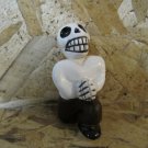 Quinoa Clay Day of the Dead Figure, Man in Brown Pants, Red Tie, Down on Bended Knee Quinoa Clay Day of the Dead Figure, Man in Brown Pants, Red Tie, Down on Bended Knee