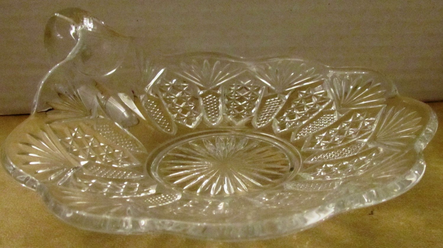 VINTAGE CUT GLASS CANDY DISH WITH FINGER LOOP HANDLE TEA CUP SAUCER