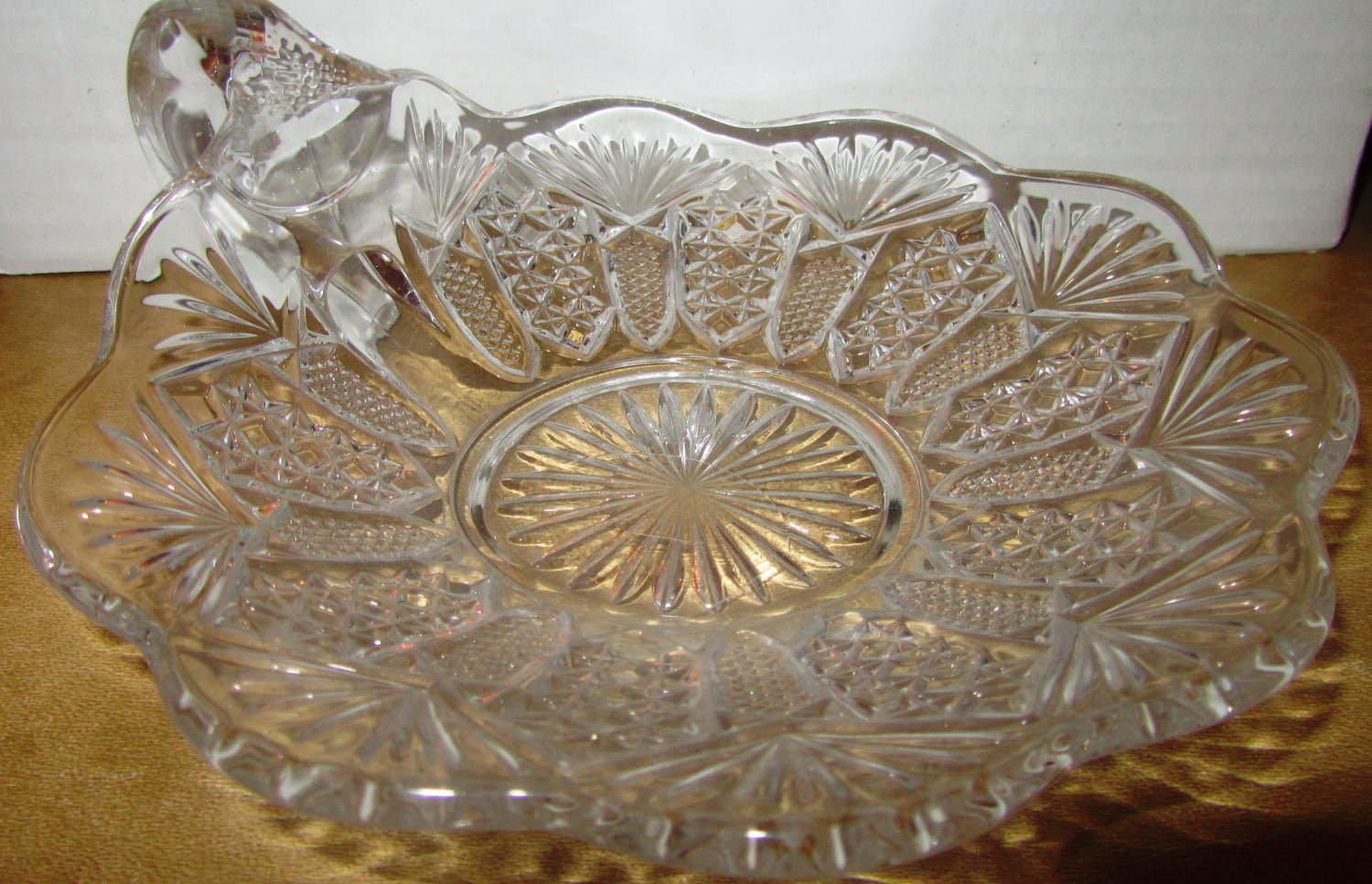 VINTAGE CUT GLASS CANDY DISH WITH FINGER LOOP HANDLE TEA CUP SAUCER
