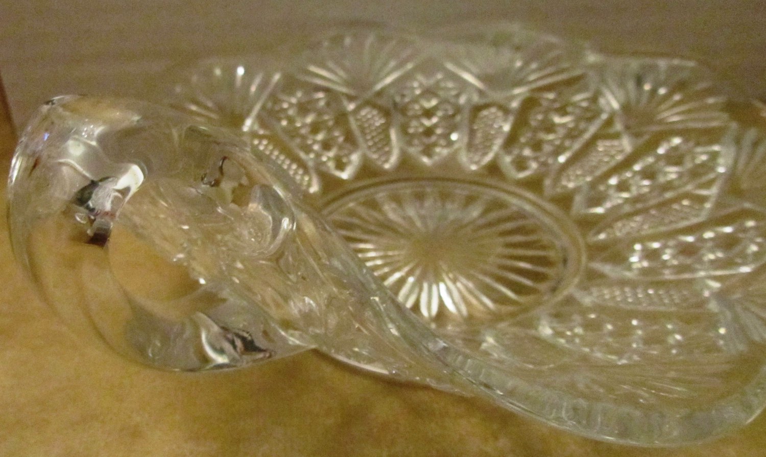 VINTAGE CUT GLASS CANDY DISH WITH FINGER LOOP HANDLE TEA CUP SAUCER