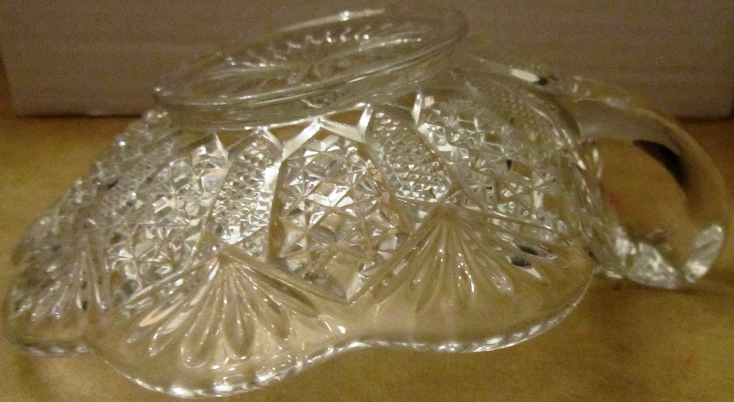 VINTAGE CUT GLASS CANDY DISH WITH FINGER LOOP HANDLE TEA CUP SAUCER