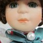 CHARMING PORCELAIN SOFT EXPRESSIONS BISQUE DOLL DRESSED AND READY FOR CHRISTMAS
