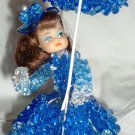 VINTAGE BLUE ROSETTE BEADS DOLL WITH UMBRELLA
