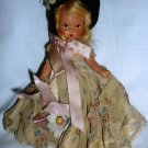 VINTAGE MINIATURE 7" DOLL IN DRESS IN BLACK HAT
