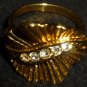 CHARMING GOLD PLATED CUBIC ZIRCONIA STONE STRING COKTAIL RING