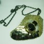 ARTIST MADE STAINLESS STEEL PENDANT ON A BLACK METAL CHAIN